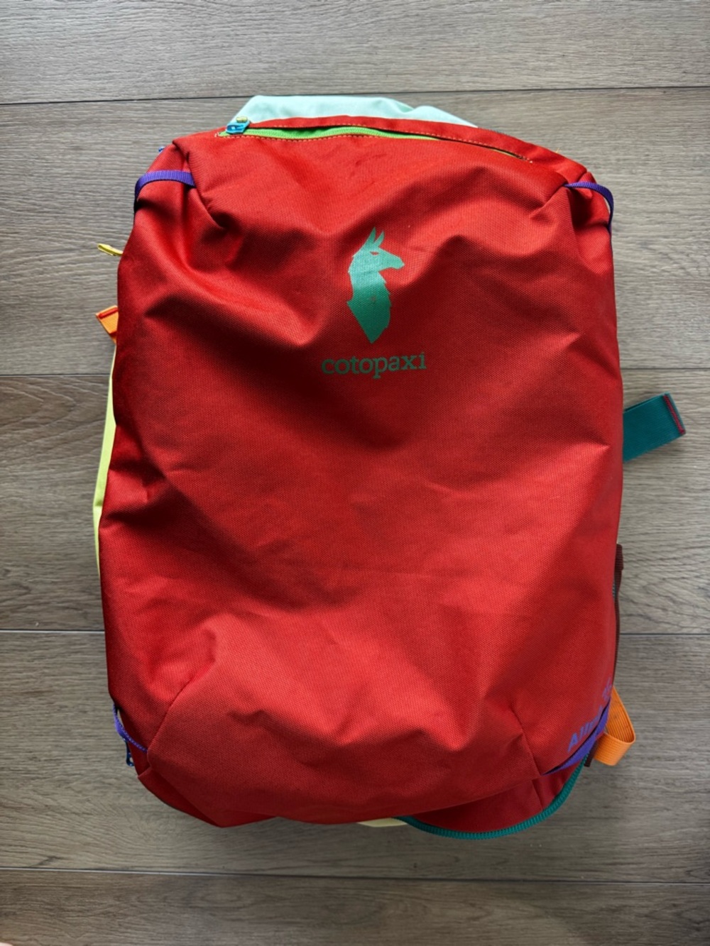 cotopaxi 35L Red Backpack with Green Logo and Multicolor Accents